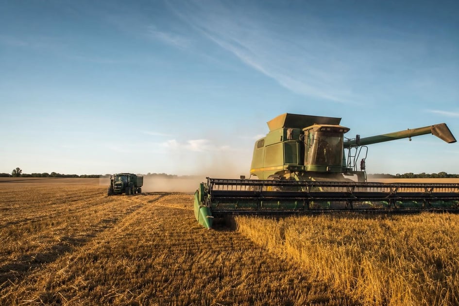 Combine harvester at a commercial worksite, illustrating agriculture equipment financing cost