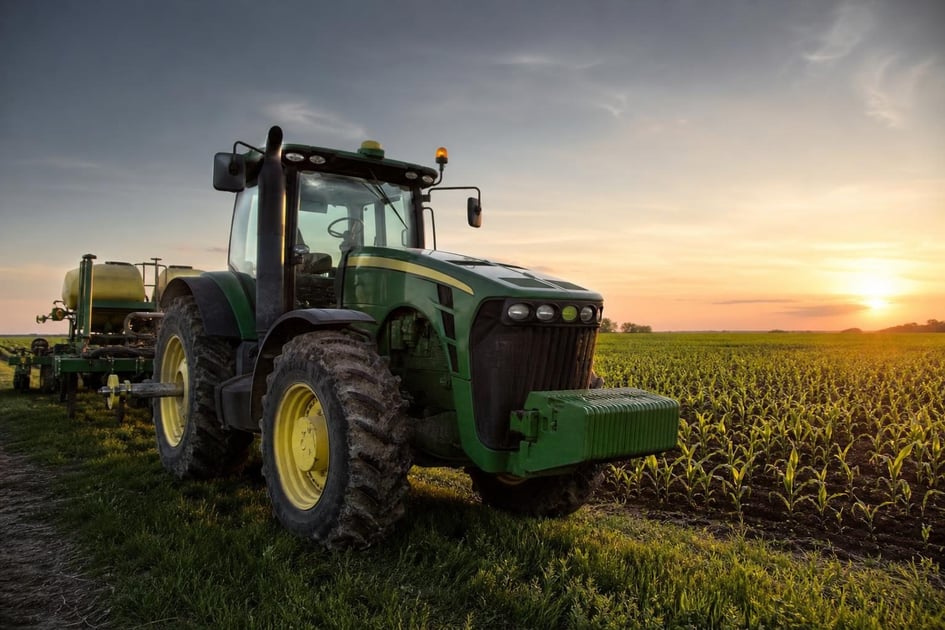 Tractor in field at a commercial worksite, illustrating agriculture equipment financing qualify for