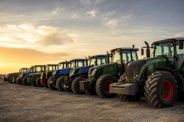 Used tractors at a commercial worksite, illustrating agriculture equipment financing used