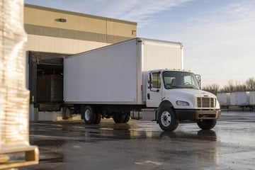 Box truck at a commercial worksite, illustrating box trucks financing no money down: what to expect