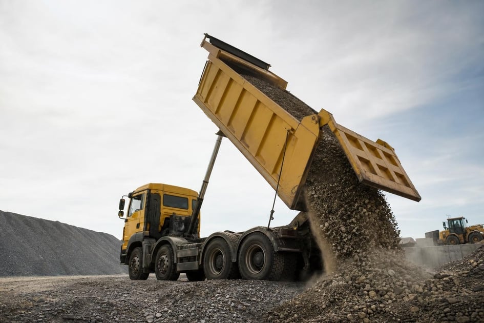 Dump truck at a commercial worksite, illustrating dump trucks financing bad credit: what to expect