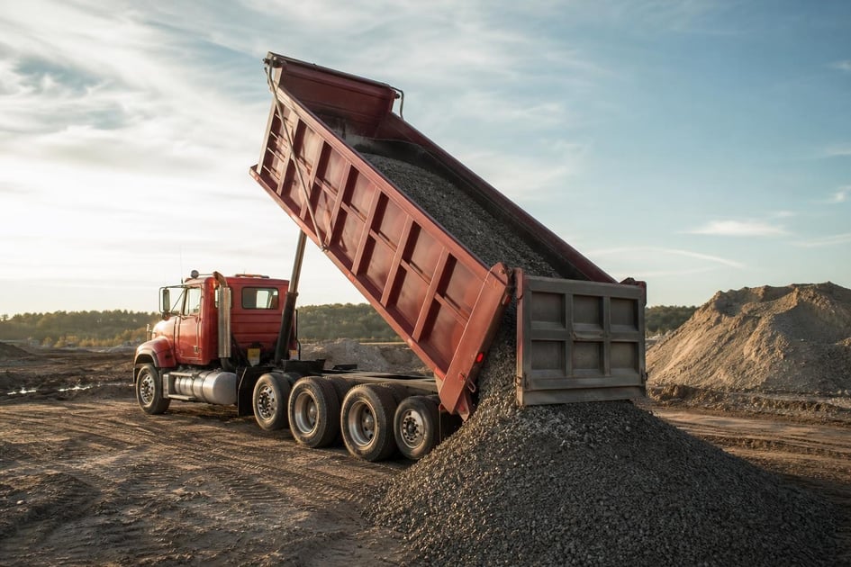 Dump truck on a job site at a commercial worksite, illustrating dump trucks financing no money down: what to expect
