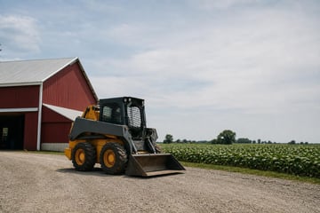 Skid steer on an illinois farm at a commercial worksite, illustrating equipment financing in illinois: rates, terms and how to qualify