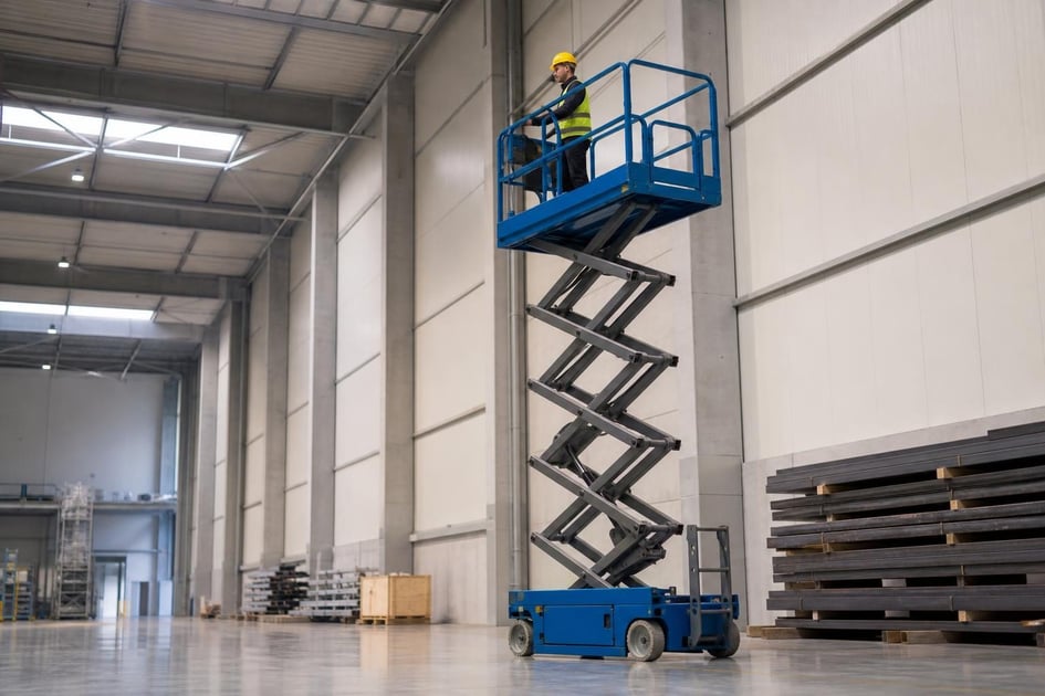 Scissor lift at a commercial worksite, illustrating scissor lifts financing for small business: what to expect