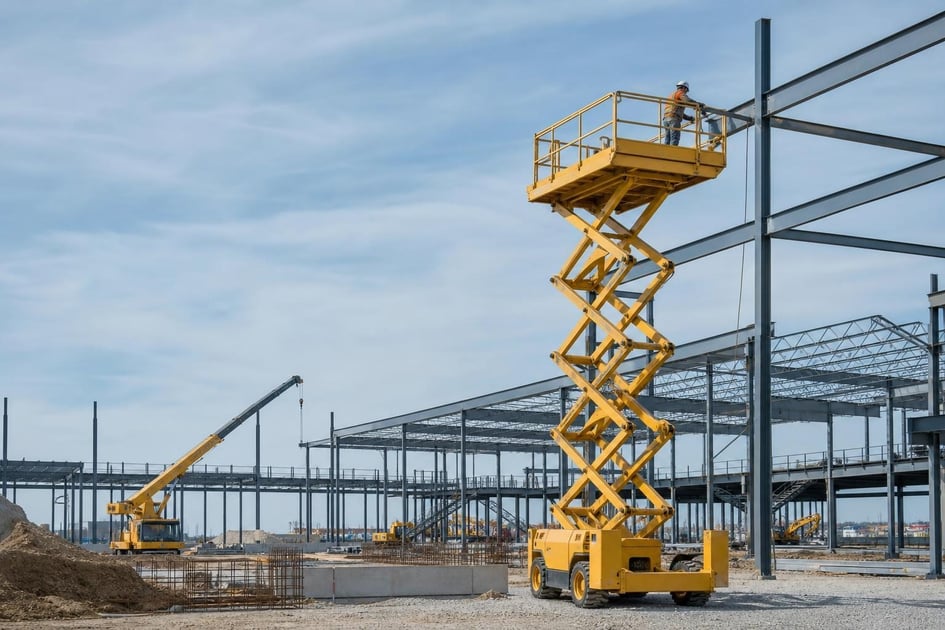 Scissor lift at a commercial worksite, illustrating scissor lifts financing how to get: what to expect