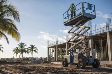 Scissor lift at a commercial worksite, illustrating scissor lifts financing in florida
