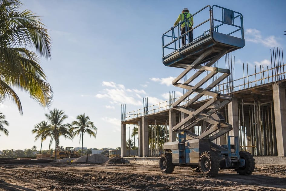 Scissor lift at a commercial worksite, illustrating scissor lifts financing in florida