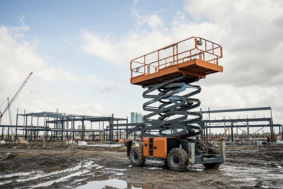 Scissor lift at a commercial worksite, illustrating scissor lifts financing in houston