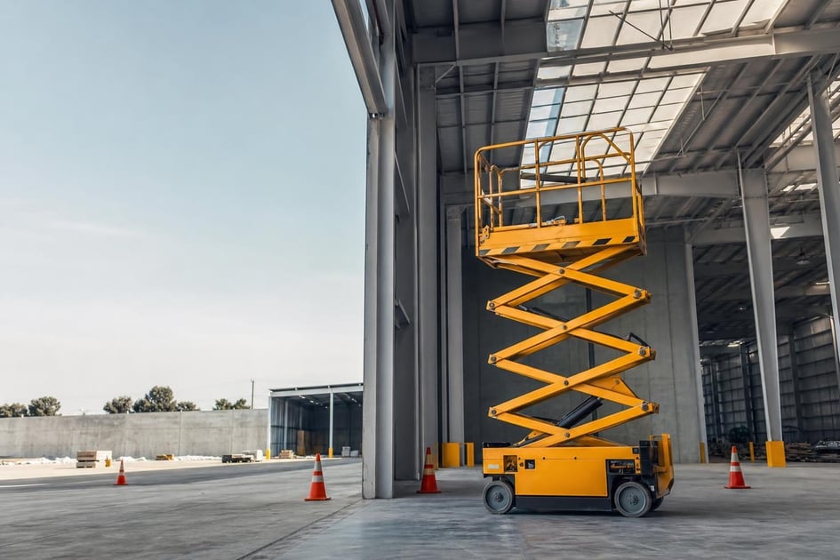 Scissor lift at a commercial worksite, illustrating scissor lifts financing no money down: what to expect