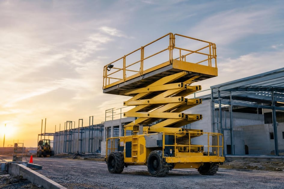 Used scissor lift at a commercial worksite, illustrating scissor lifts financing used: what to expect
