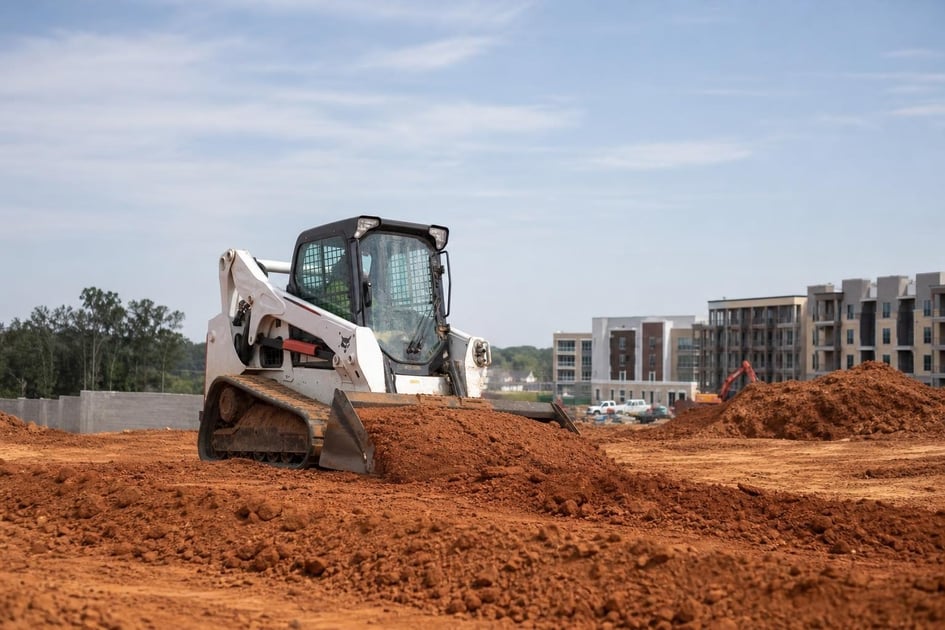 Skid steer at a commercial worksite, illustrating skid steers financing in georgia