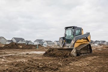Skid steer loader at a commercial worksite, illustrating skid steers financing in ohio