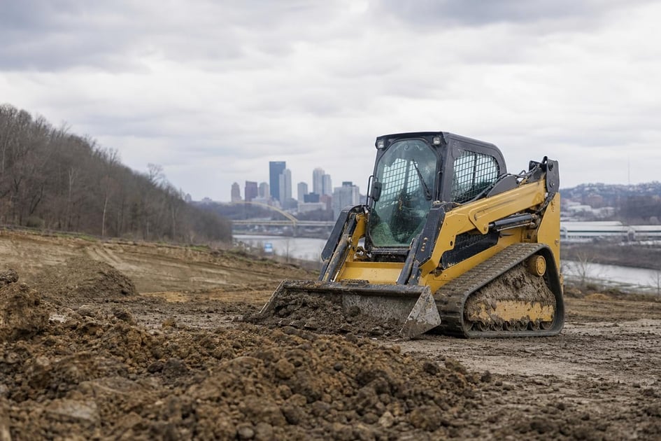 Skid steer loader at a commercial worksite, illustrating skid steers financing in pennsylvania