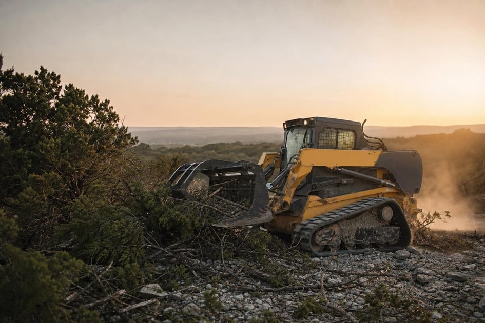 Skid steers at a commercial worksite, illustrating skid steers financing in texas