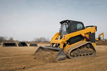 Skid steer loader at a commercial worksite, illustrating skid steers financing qualify for: what to expect