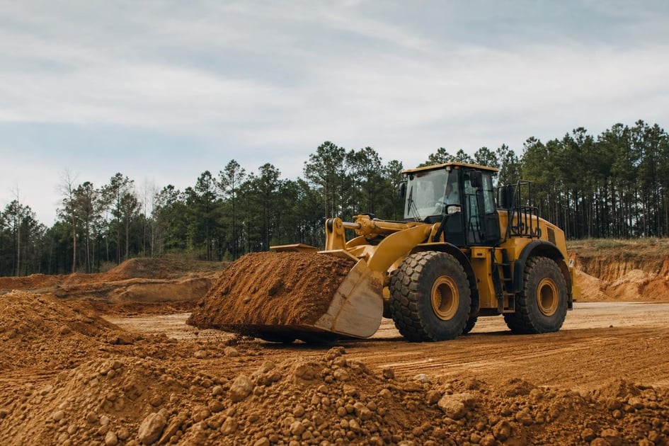 Wheel loaders at a commercial worksite, illustrating wheel loaders financing in georgia