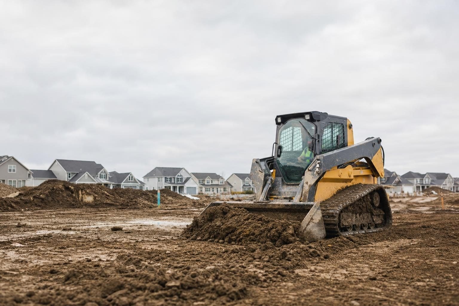 Skid steer loader at a commercial worksite, illustrating skid steers financing in ohio